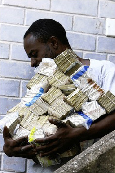 A Men with Zimbabwean Currency